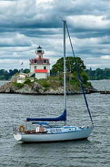 Sailboat Moored in Front of Pomham Rocks Lighthouse